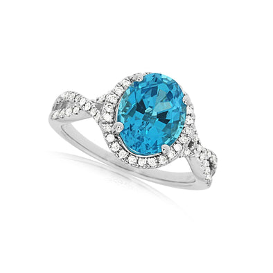 Oval Blue Topaz and Diamond Halo Ring